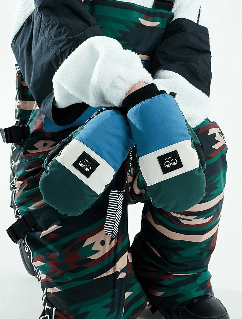 Woman wearing colorful waterproof ski gloves with anti-slip design, perfect for staying warm and stylish on the slopes.
